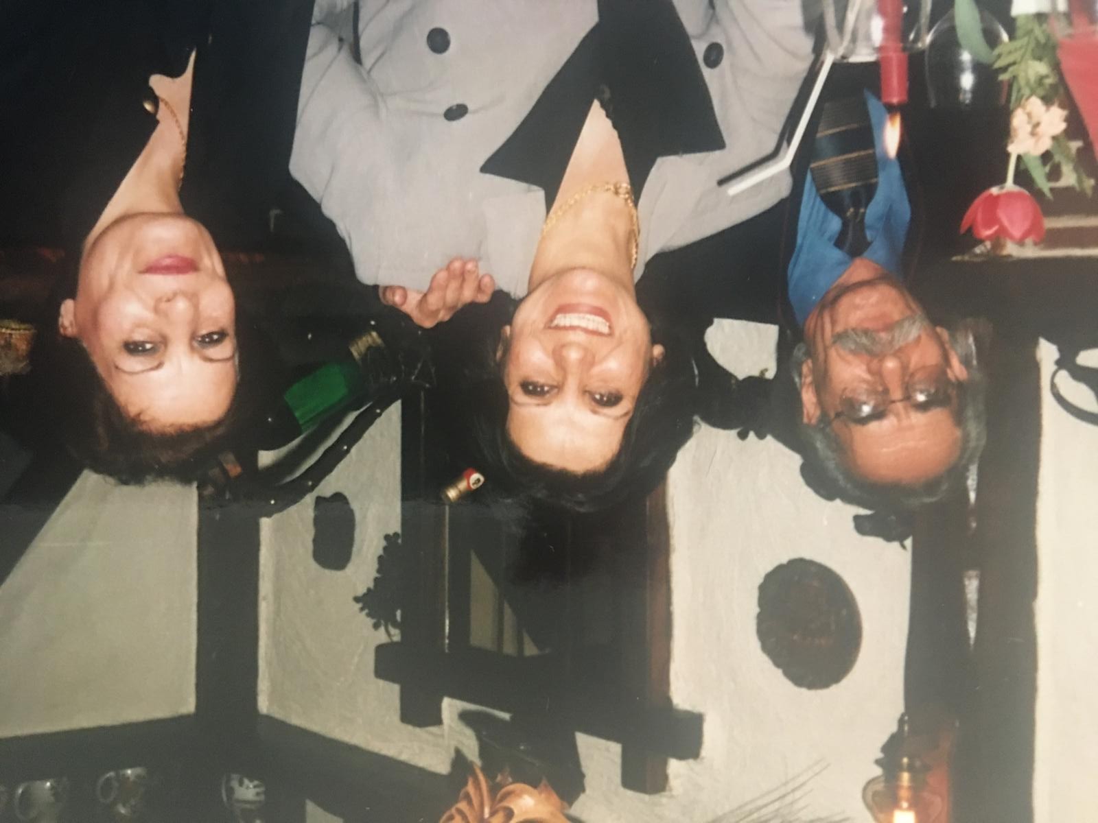 With his sisters, Fahimeh Azadi and Farideh Azadi, around the table